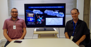 Ricardo dos Reis (left) and Narcizo Souza-Neto (right), main authors of the paper. Between them, a screen with the representation of EMA beamline where XMCD experiments will be available in Sirius fourth-generation synchrotron source.