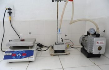 Instrumentation used to prepare the nanofoams. From the left: heating plate to keep the solution above the phase separation temperature, Peltier cooling system and vacuum pump for solvent removal by sublimation.